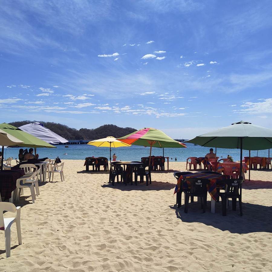 Tables on the sand at Playa Santa Cruz, Mexico.