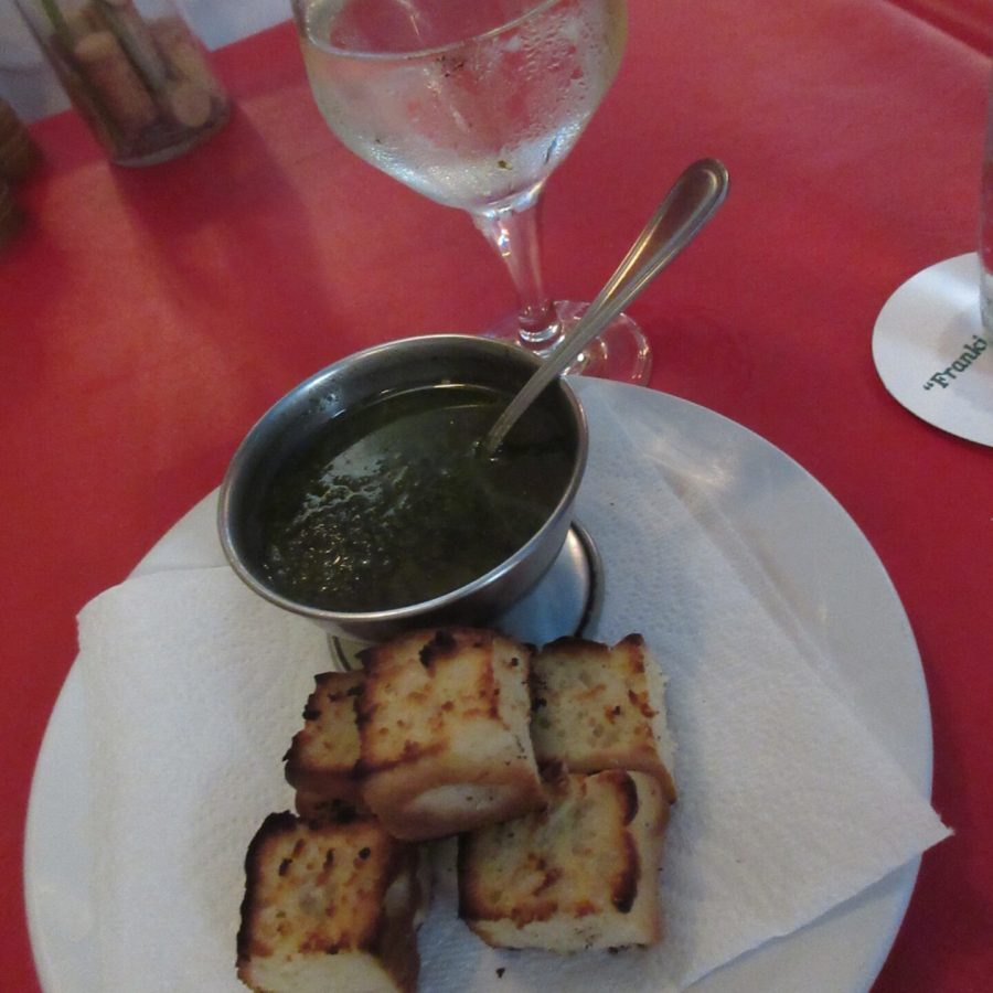 Home made pesto and bread on a plate
