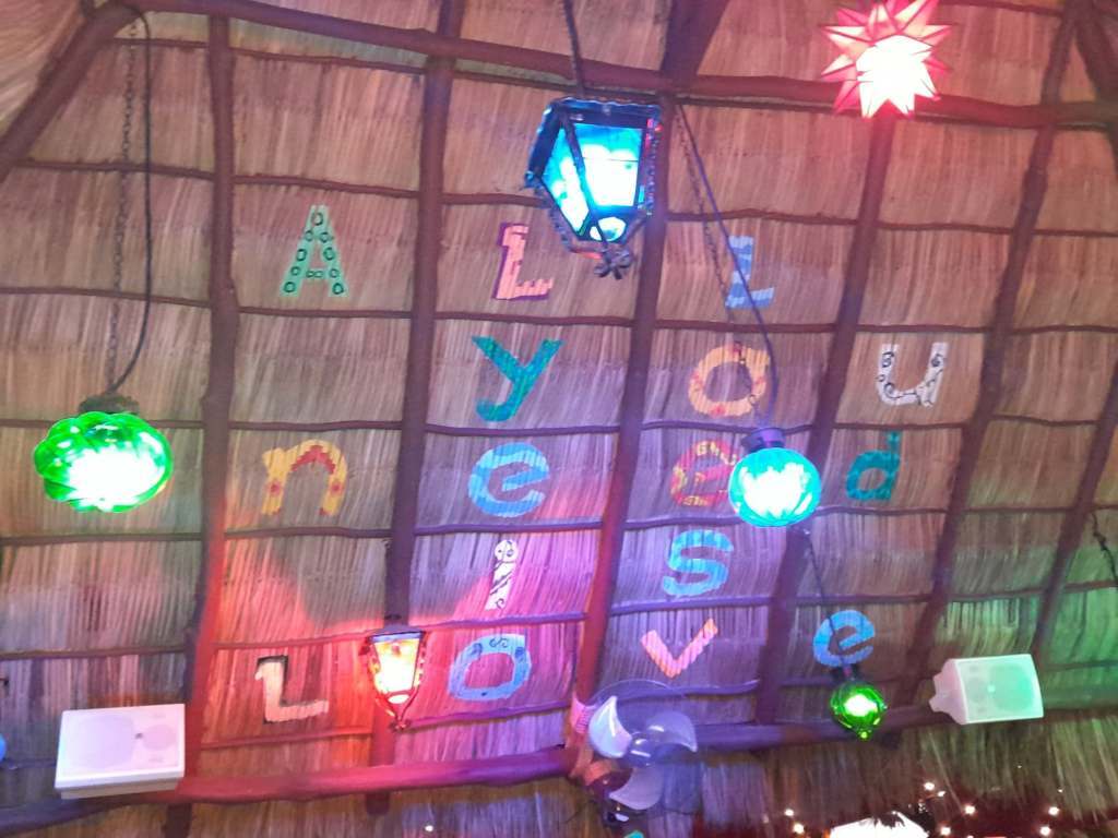 The roof of Margarita Grill with the words 'all you need is love'.