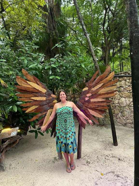 Posing with the wings at the Ahau Sculpture park